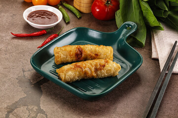 Vietnamese stuffed spring roll served sauce