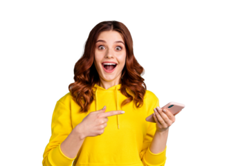Photo of beautiful cheerful ecstatic attractive curly wavy trendy stylish youngster pointing at telephone held with hands wearing yellow sweater hoodie isolated over vivid teal color background