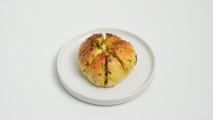 A close-up shot of freshly baked Korean cream cheese garlic bread, showcasing its soft, golden-brown exterior and the generous filling of creamy cheese and fragrant garlic butter.
