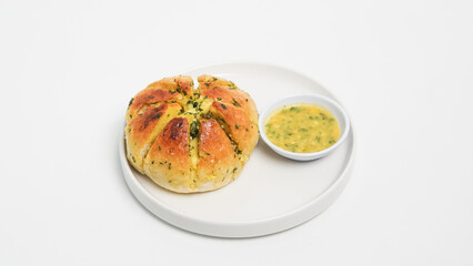 A close-up shot of freshly baked Korean cream cheese garlic bread, showcasing its soft, golden-brown exterior and the generous filling of creamy cheese and fragrant garlic butter.