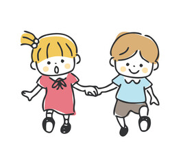 手をつないで歩く男の子と女の子