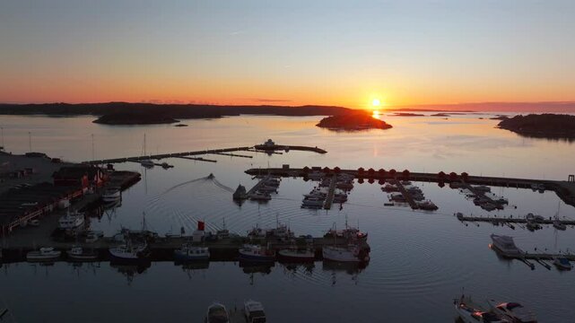 Str&ouml;mstad Stromstad Sweden aerial drone boat trolling arctic golden sunset sun on horizon Sandelfjord Fjord Baltic Sea Seaside Town marina harbor picturesque Koster islands Oscarspromenaden forward