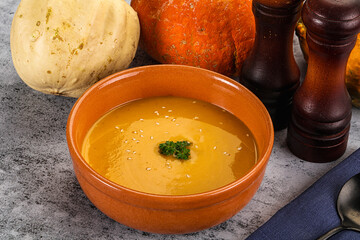 Vegan pumpkin cream soup served sesam