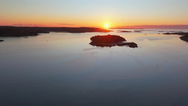 Str&ouml;mstad Stromstad Sweden aerial drone Scandinavia Arctic Circle sea islands golden sunset sun rays on horizon peaceful calm still Sandelfjord Fjord Skagerrak Baltic marina harbor forward pan up