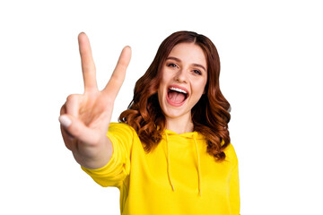 Photo of sweet white curly wavy charming cute pretty youth showing you v-sign screaming overjoyed...