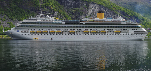 Modern mega cruiseship cruise ship liner Favolosa in Geirangerfjord with panoramic views of...