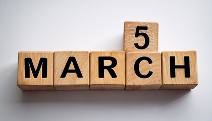 Minimalist photo of a wooden blocks with date 5 March. Day and month, calendar on white background