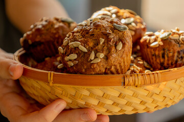  healthy muffins topped with a mix of seeds, perfect for a grab-and-go breakfast