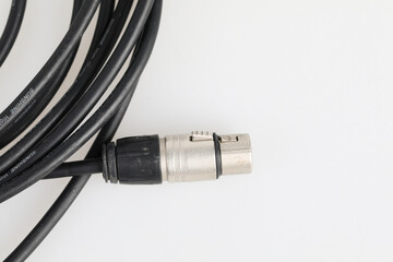 Audio equipment connection studio setup cable detail professional environment close-up view sound quality enhancement