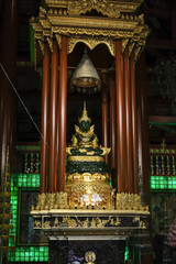 The jade buddha statue or Phra Yok Chiang Rai in the Lanna ubosot at Wat Phra Kaew Chiang Rai.