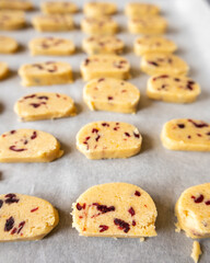 raw, ready-to-bake orange and cranberry cookie dough