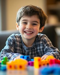 Young boy with autism enjoys playing with colorful sensory toys during National Autism Awareness Month
