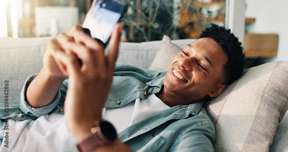 Aufkleber man, happy and relax with phone on sofa for weekend break, dating site chat or streaming service. sm