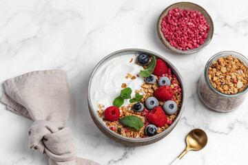 yogurt with granola, oatmeal, raspberries, mint, blueberries, breakfast