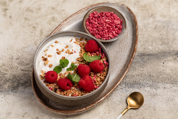 yogurt with granola and raspberries, breakfast