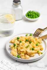 Plate of tasty scrambled eggs, breakfast
