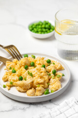 Plate of tasty scrambled eggs, breakfast