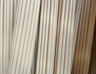 General stock. - Piles of plastic electrics or cable protection pipes at a DIY builders merchants. ..wood, wooden, builder, materials, material, supplies, tool tools, piping