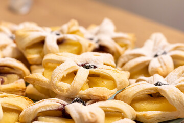 Freshly baked fruit puff pastries on the ceramic plate. Baking