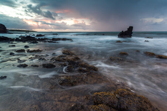 Seascape, rocky coast at sunrise with dramatic light, Martinique island, Caribbean