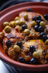 Chicken cooked with olives.