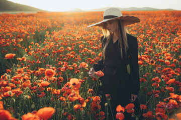 Beautiful woman in a field with flowers