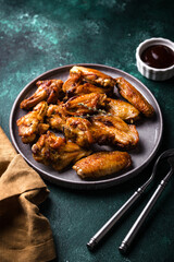 Baked roasted chicken wings with sauce