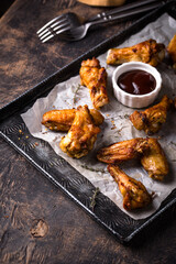 Baked spicy chicken wings with sauce