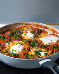 eggs and beans dinner in a pan close-up