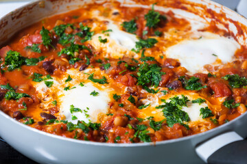 eggs and beans dinner in a pan close-up