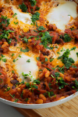 eggs and beans dinner in a pan close-up