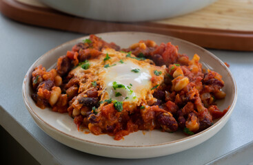 eggs and beans dinner in a pan close-up