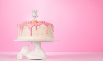 A festive birthday cake topped with candle