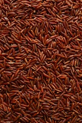 Pile of brown rice as a background, close up