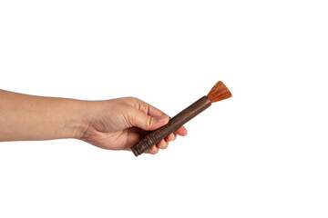 Hand using a little paintbrush isolated on a transparent background