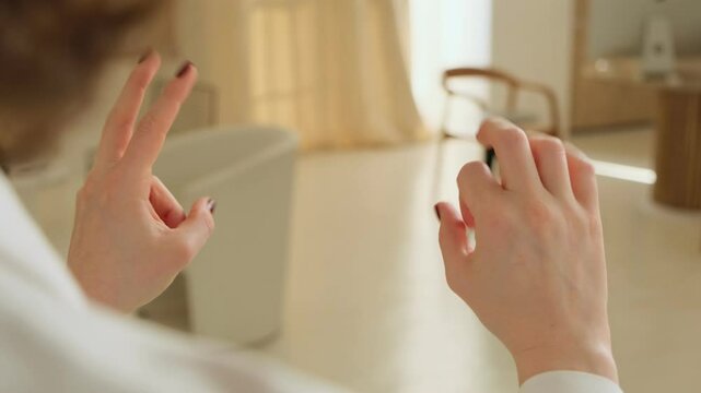 Five-minute break from office work. Close-up of hands performing a neurogymnastics exercise gestures to stimulate brain activity.