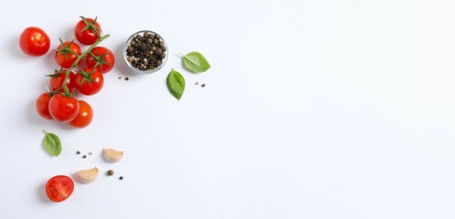 Fresh red tomatoes, pepper and basil on white background, top view