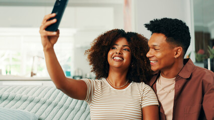 Obraz premium Love, relax and selfie with couple on sofa in living room of home together for memories. Bonding, photograph and smile with people in apartment for social media or profile picture update on weekend