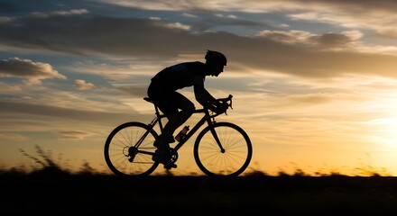 Silhouette of a Cyclist Riding at Sunset