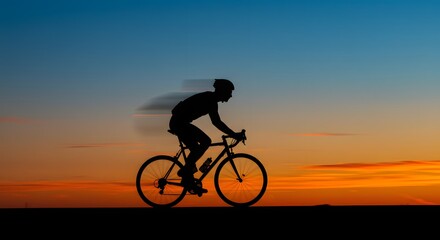 Fototapeta premium Silhouette of a Cyclist Riding at Sunset