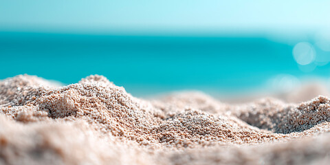 Beach with a blue ocean in the background. The sand is white and the water is calm