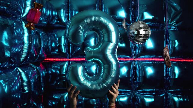 Party Background with Number 3 Foil Balloon, Disco Balls, and Lights