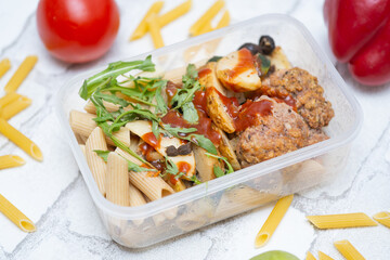 Balanced and tasty lunchbox next to fresh fruits and vegetables—perfect for healthy eating, calorie counting, and meal prep inspiration. Ideal for wellness, fitness, and nutrition-focused content.