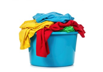 A blue laundry basket filled with colorful clothes on a white background in studio light