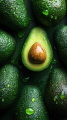 A green avocado with a brown seed in the middle
