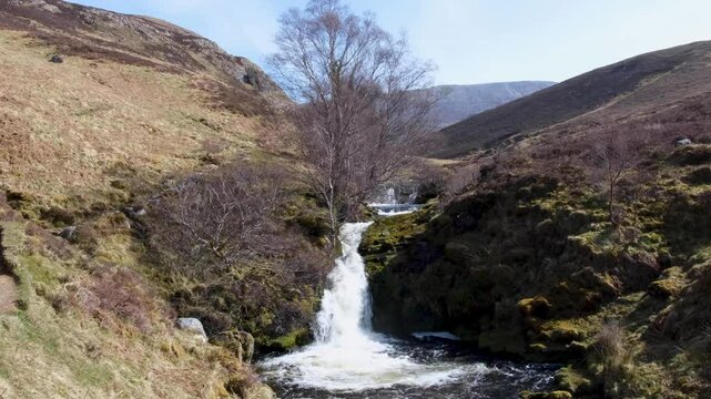 Scenic view of Scottish cascading waterfalls and river at Bone Caves of Inchnadamph in Sutherlands highlands of Scotland UK