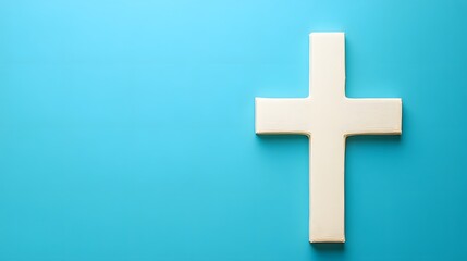 Obraz premium White Wooden Cross on Blue Background Christian Faith Symbol