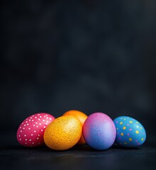 Obraz premium Colorful Easter eggs arranged artistically on dark background for festive decoration