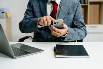Businessman s hands typing on smartphone, tablet and laptop keyboard computer,