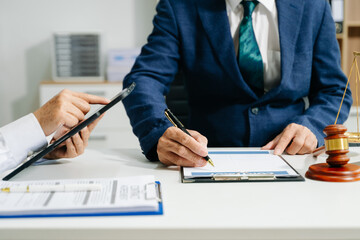 Business and lawyers discussing contract papers with brass scale on desk in office. Law, legal services, advice